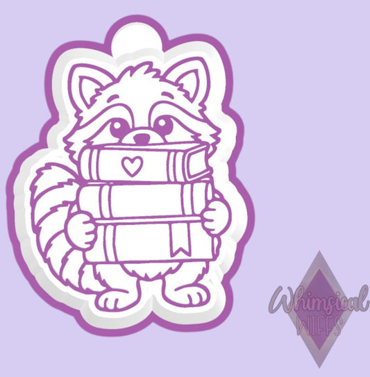 Raccoon with Book Stack design for a silicone freshie mold