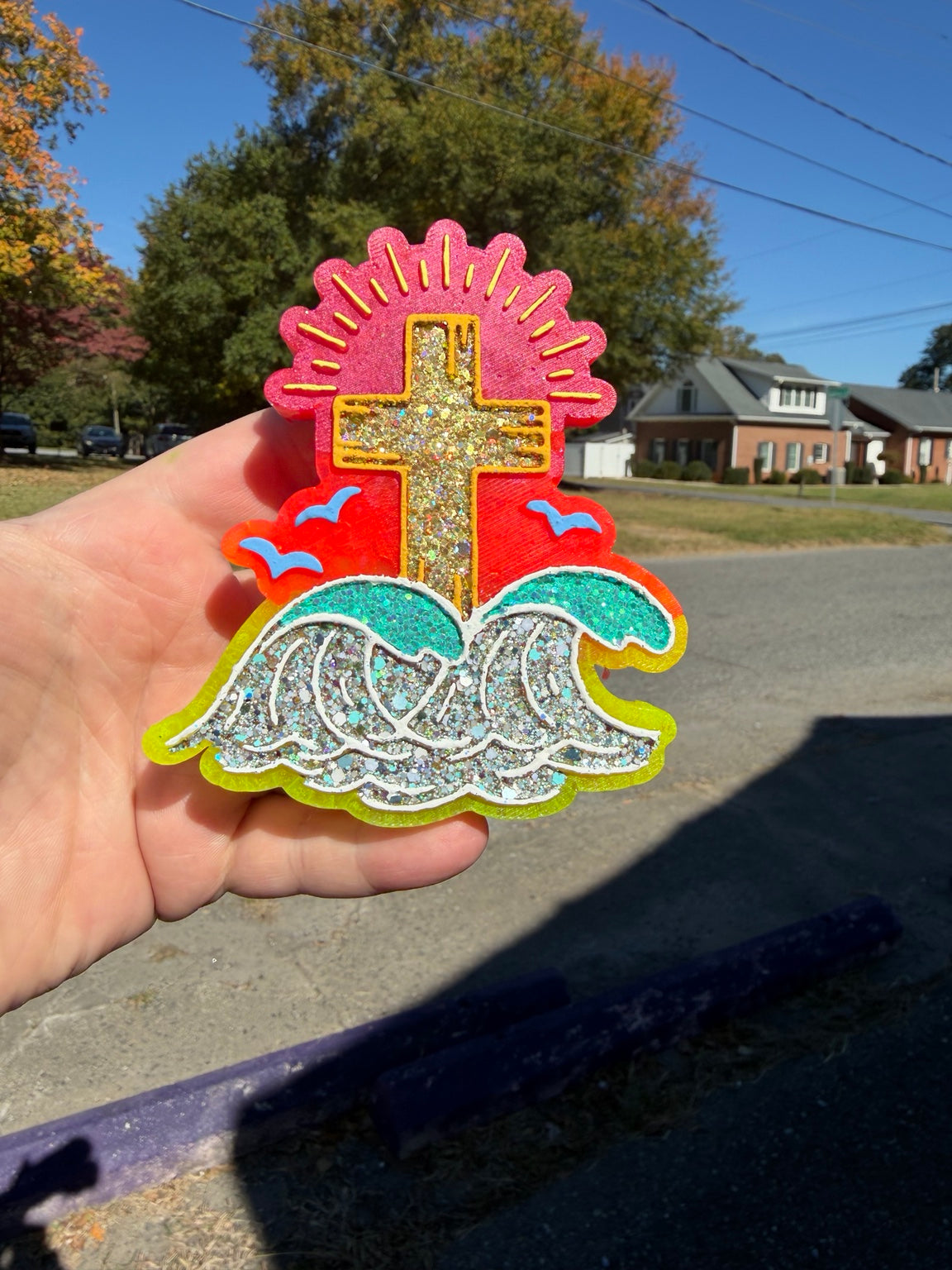 Cross and ocean waves handmade freshie with sunburst, birds, and a colorful background