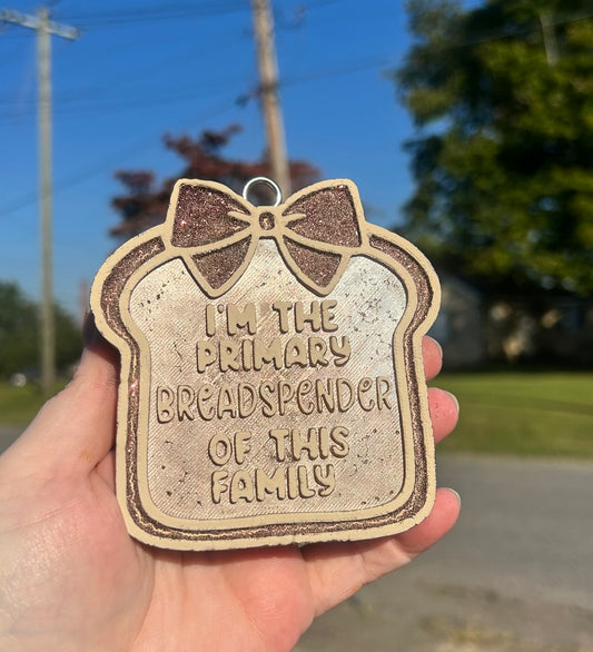 Primary Breadspender handmade car freshie shaped like a bread slice with bow and text I'm the primary breadspender of this family