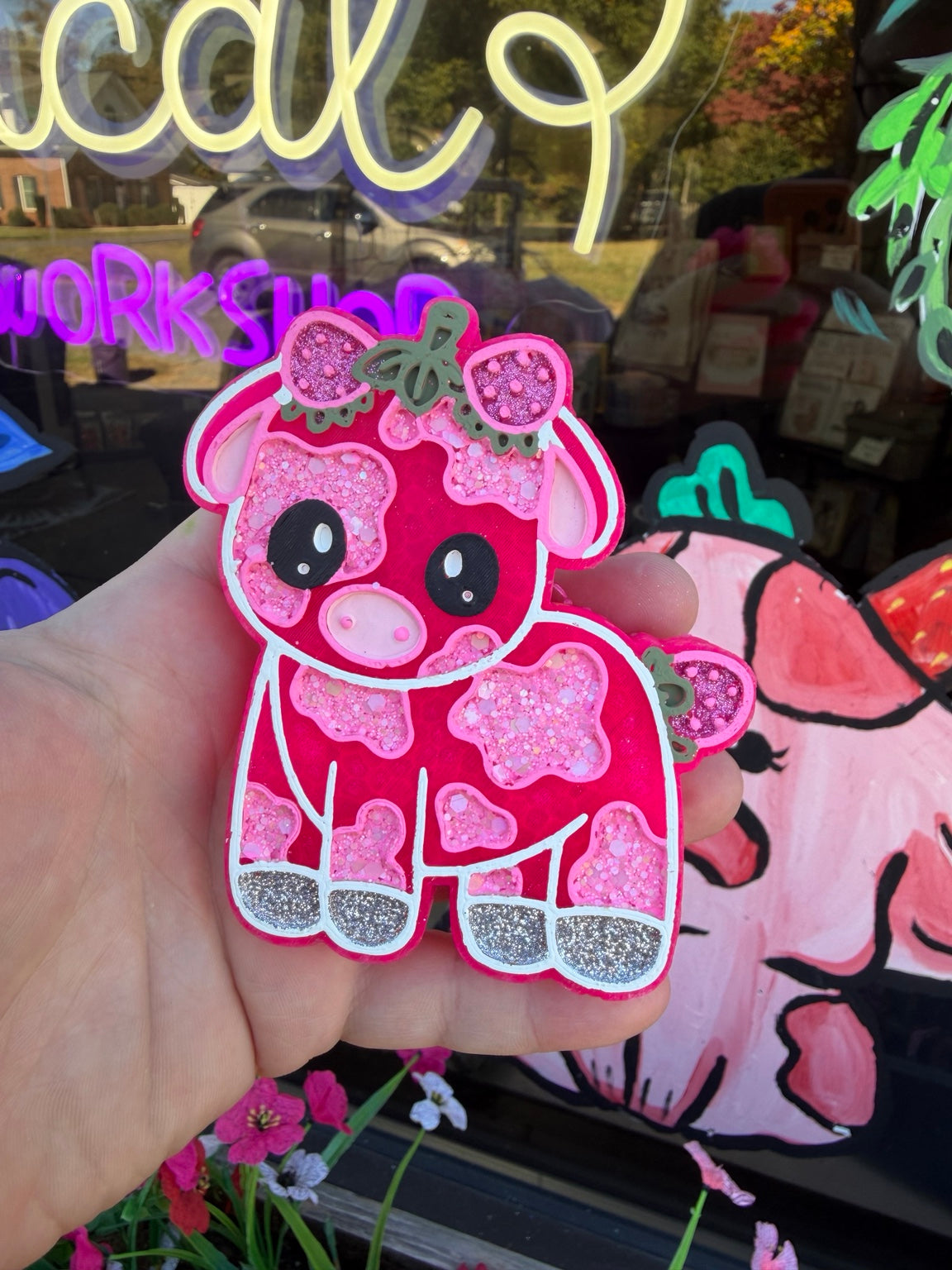 Cute strawberry cow handmade car freshie with bow, strawberry accents, and glitter detailing